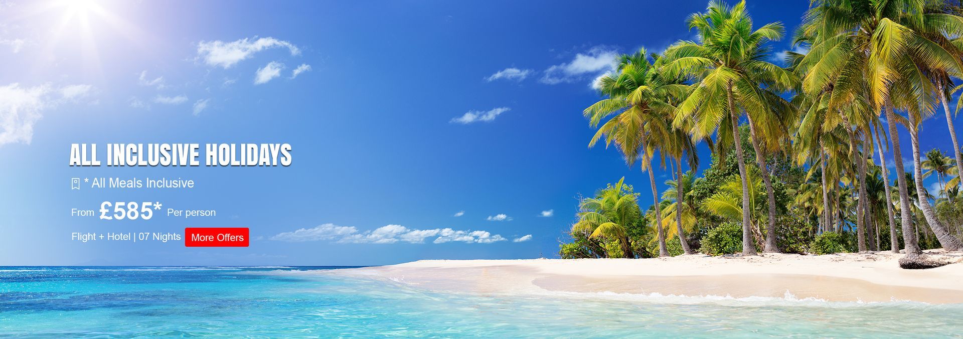 An aerial view of a beach with umbrellas and buildings in the background.
