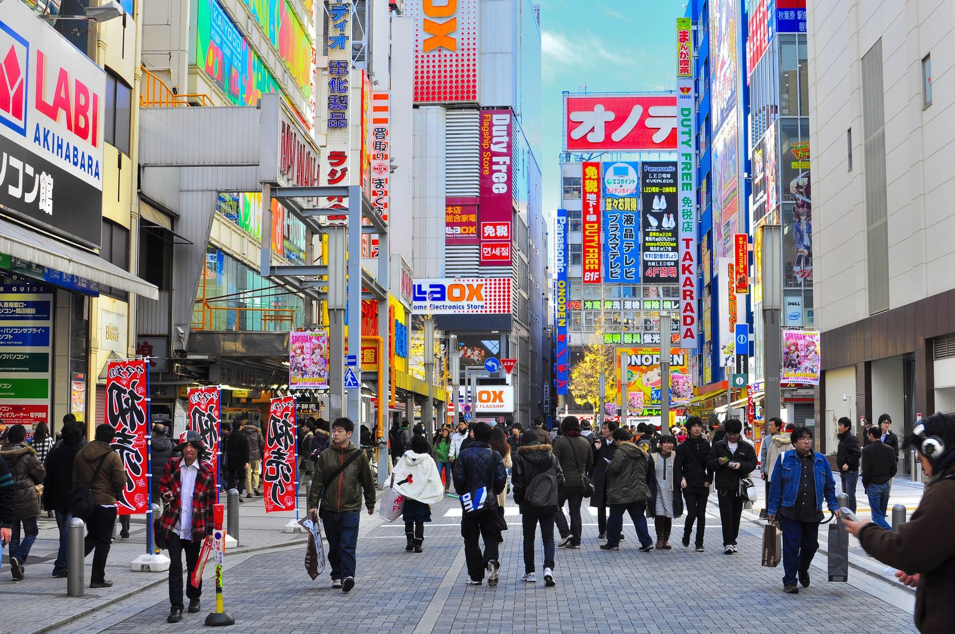 Pedestrians walking through Akihabara Electric Town, a shopping hub in Tokyo, Japan.