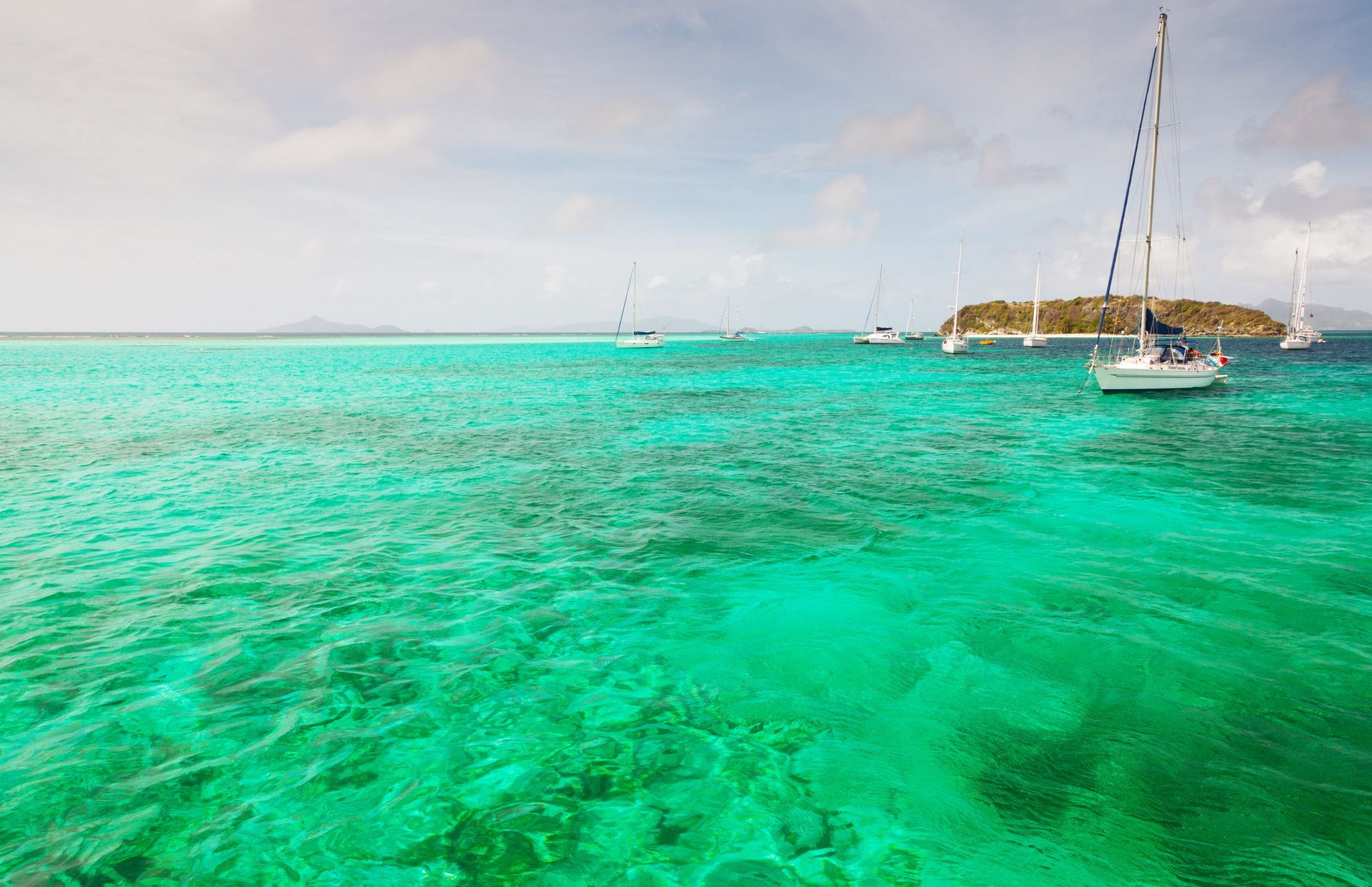 Anchored yachts and catamarans in the Caribbean Sea in Trinidad and Tobago.