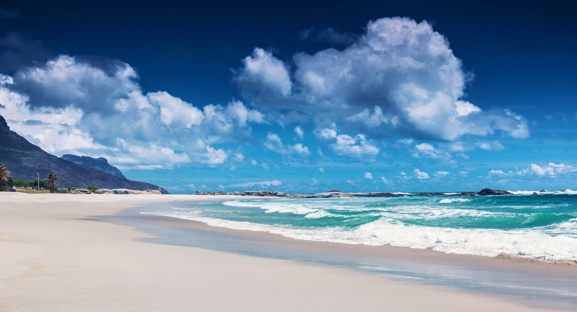 Panoramic view of Camps Bay Beach in Cape Town, South Africa.