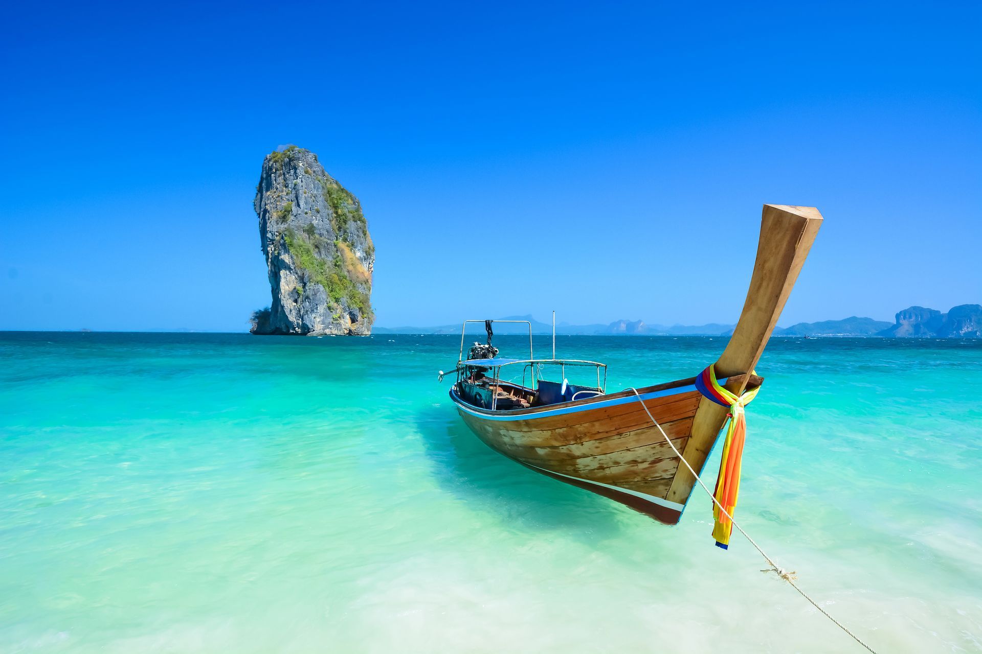 Clear blue ocean landscape with traditional boat Taxi in Thailand.
