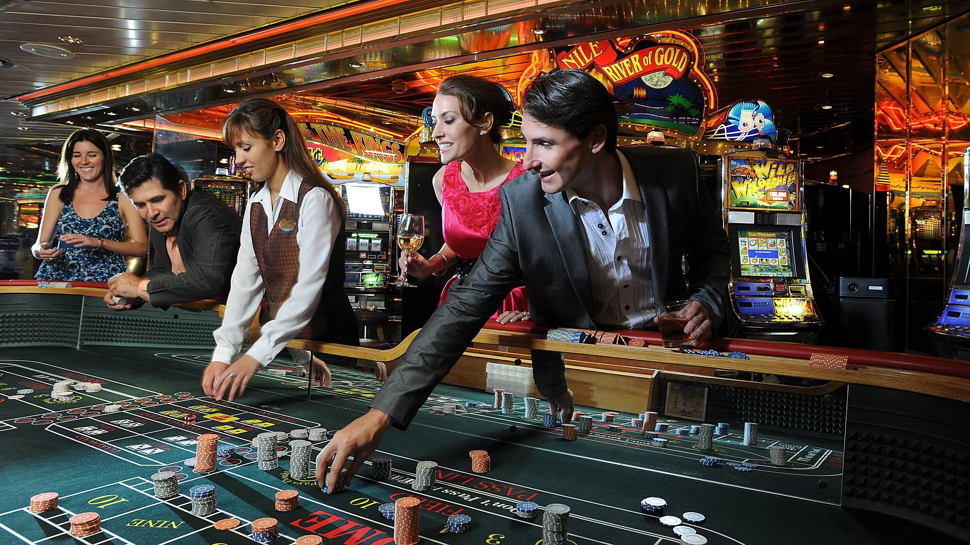 A group of people are playing roulette in a casino.
