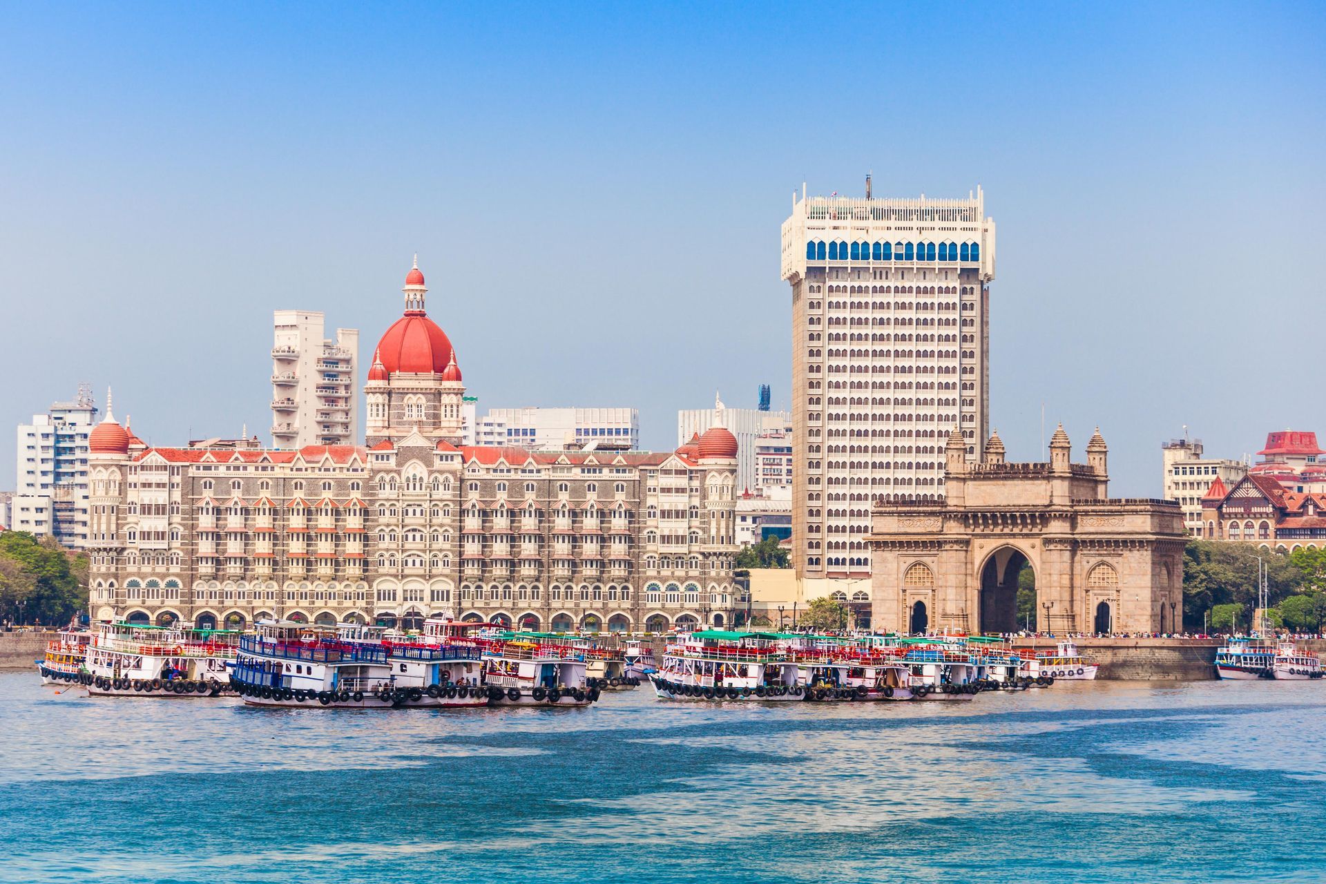 Water view of The Taj Mahal Palace and The Gateway of India in Mumbai.