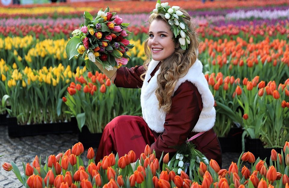 A young woman in a tulip garden in Amsterdam.