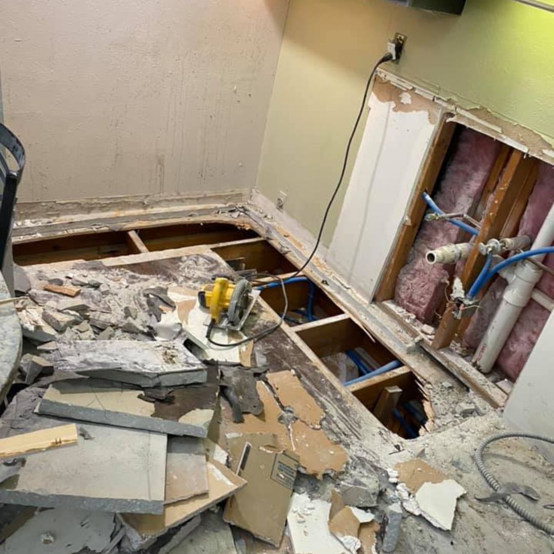 A room under construction with a hole in the floor