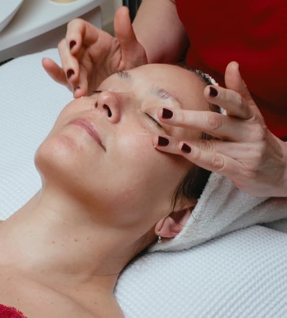 CIDESCO-certified beautician Julia Hediger applies a lifting cream to a client during an eye lift treatment.