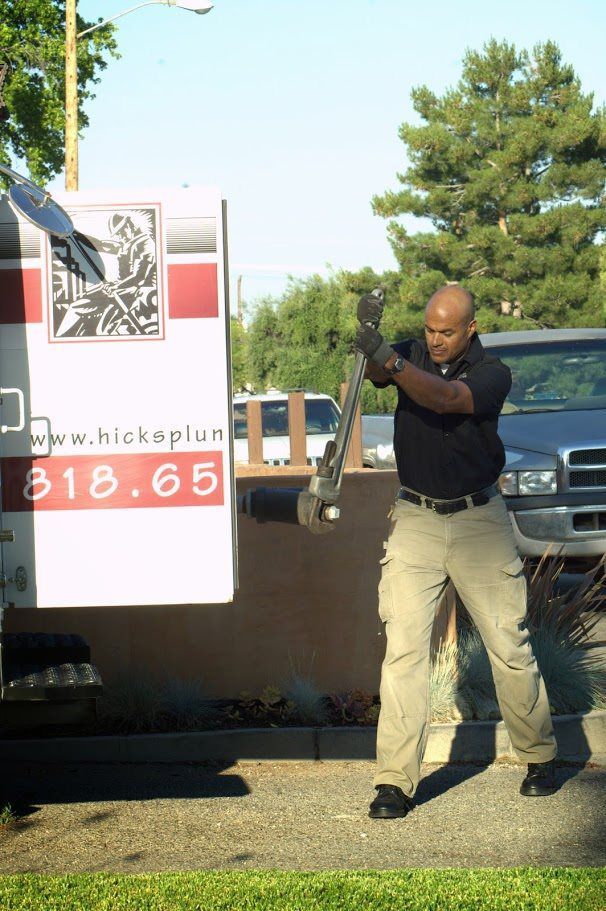A man is standing in front of a truck that says 318.65