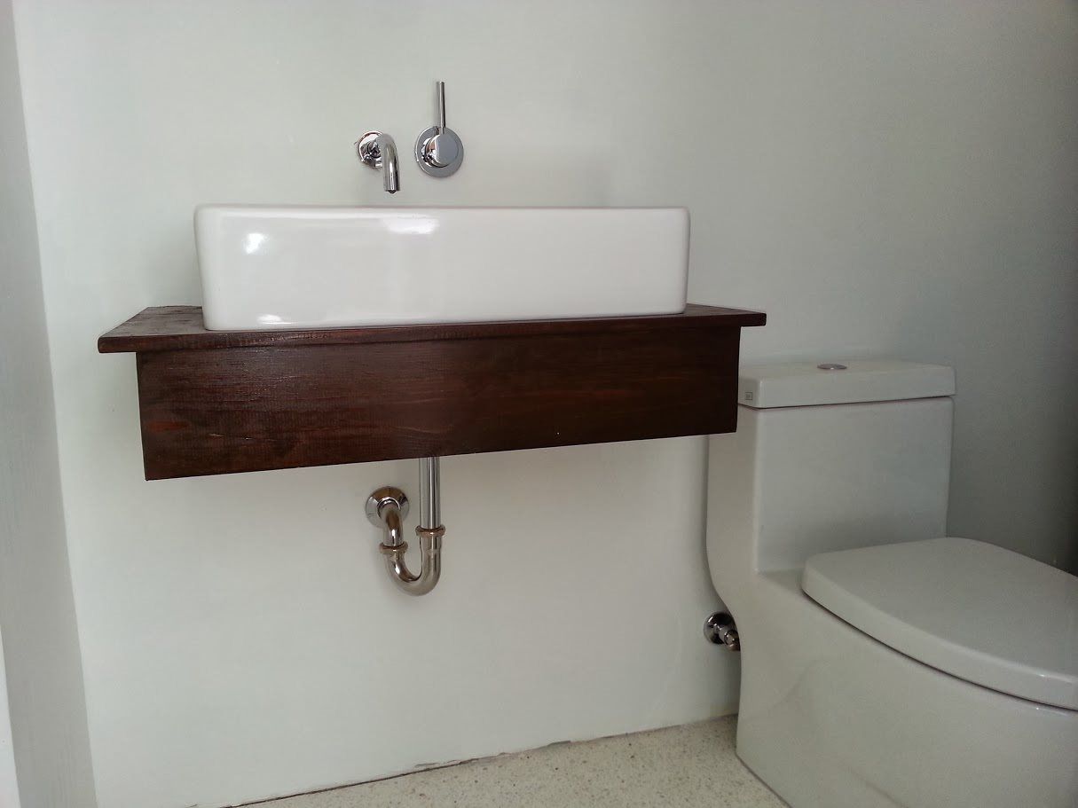 A bathroom with a toilet and a sink