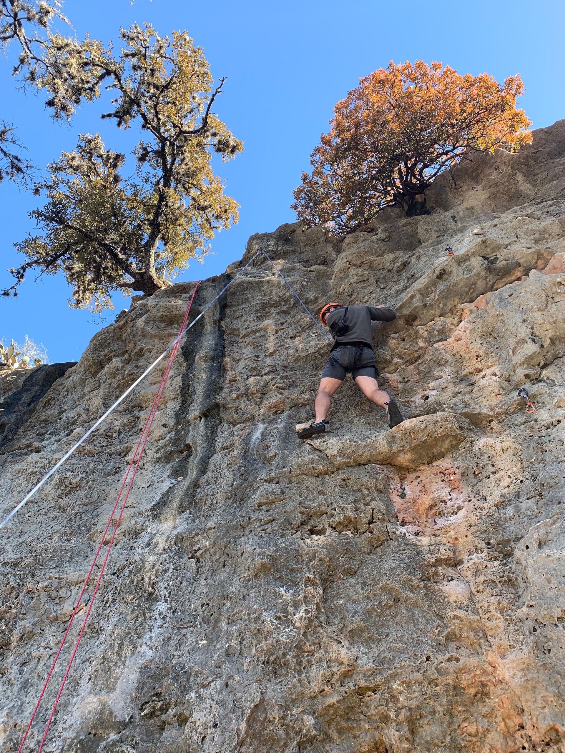 A person climbs a rock wall