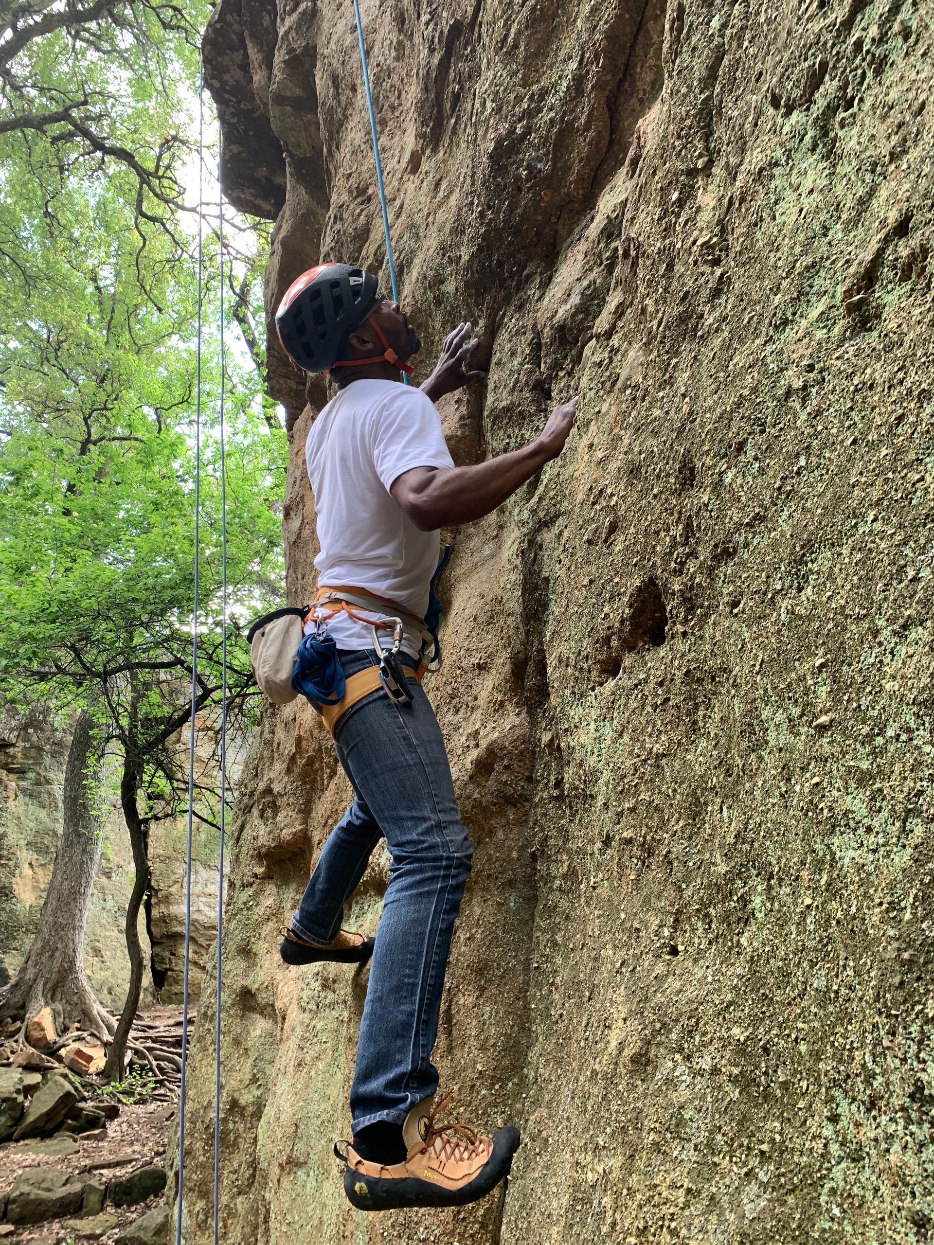 A person is climbing a rock wall