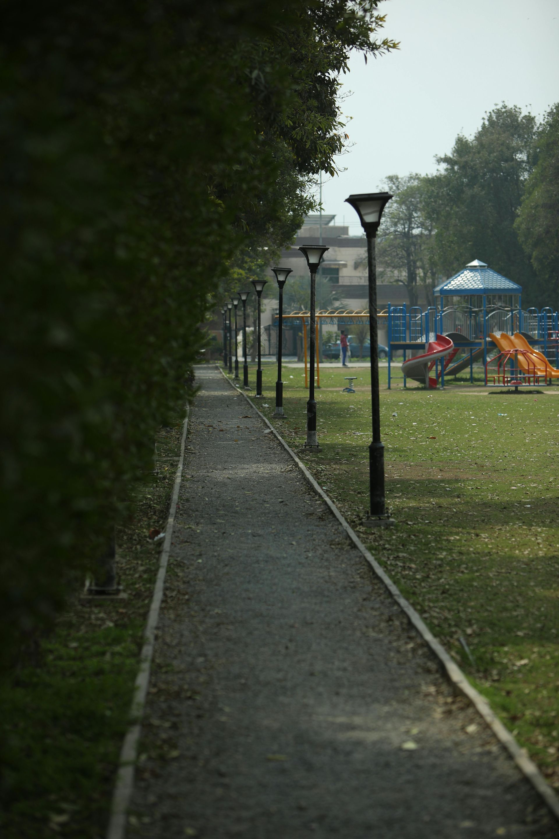 Walking path and playground in a park