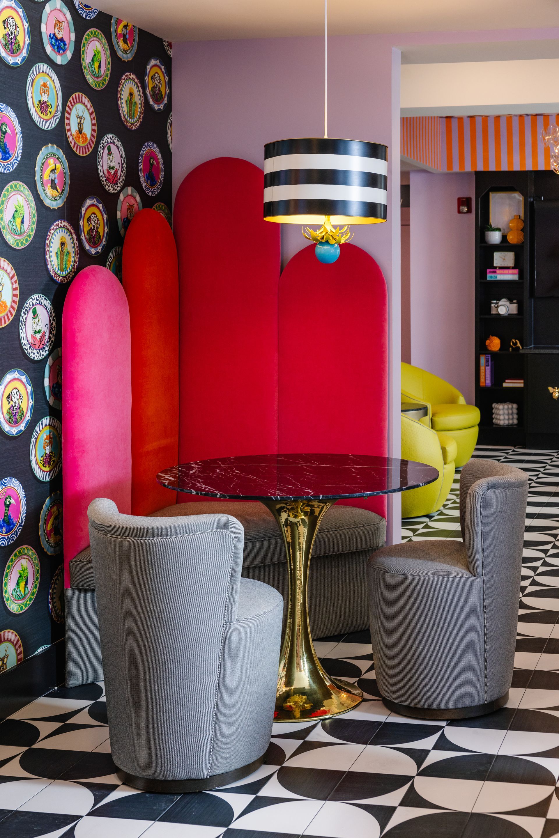 A room with a table and chairs in it