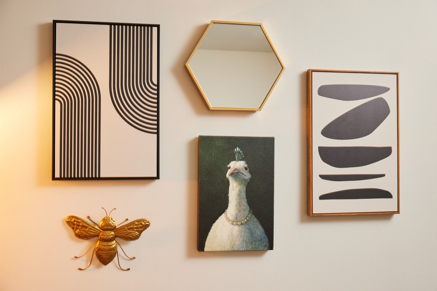 A collage of paintings and mirrors on a wall