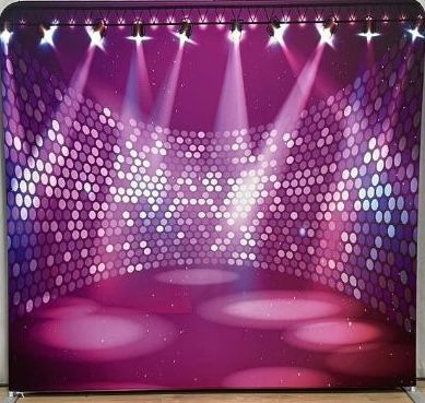 Purple stage backdrop with disco ball lights, spotlights, and dance floor.