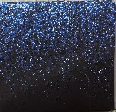 Blue glitter sparkles against a black background.