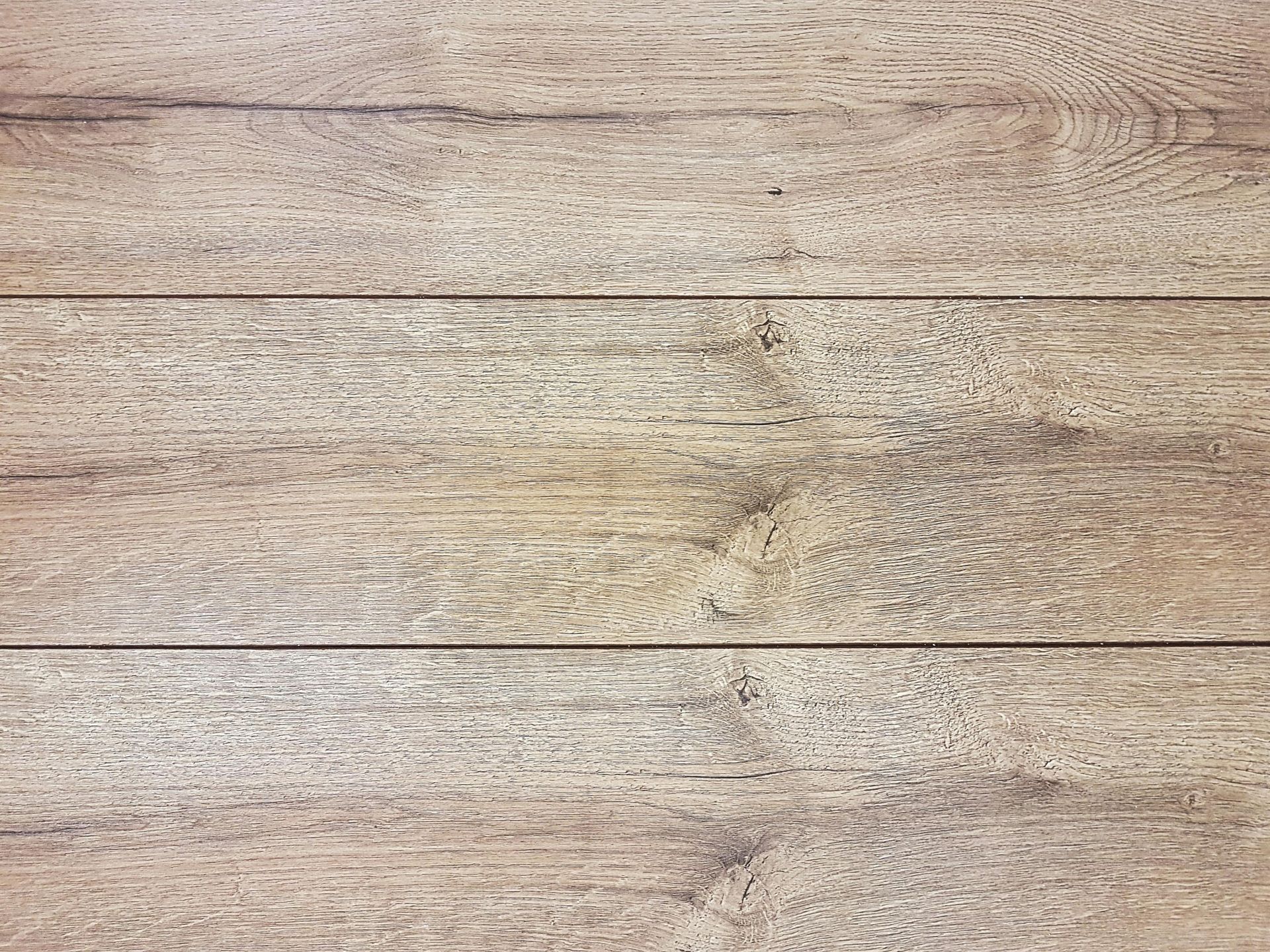Light brown wooden planks, horizontal, with visible wood grain texture.