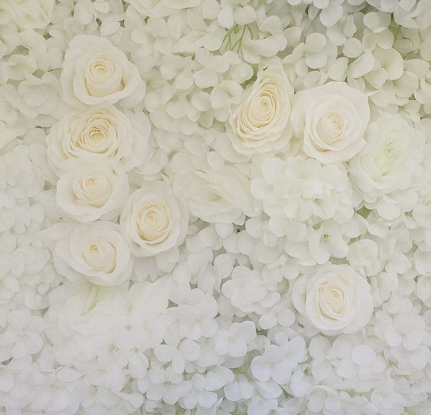 White floral wall with roses and hydrangea.