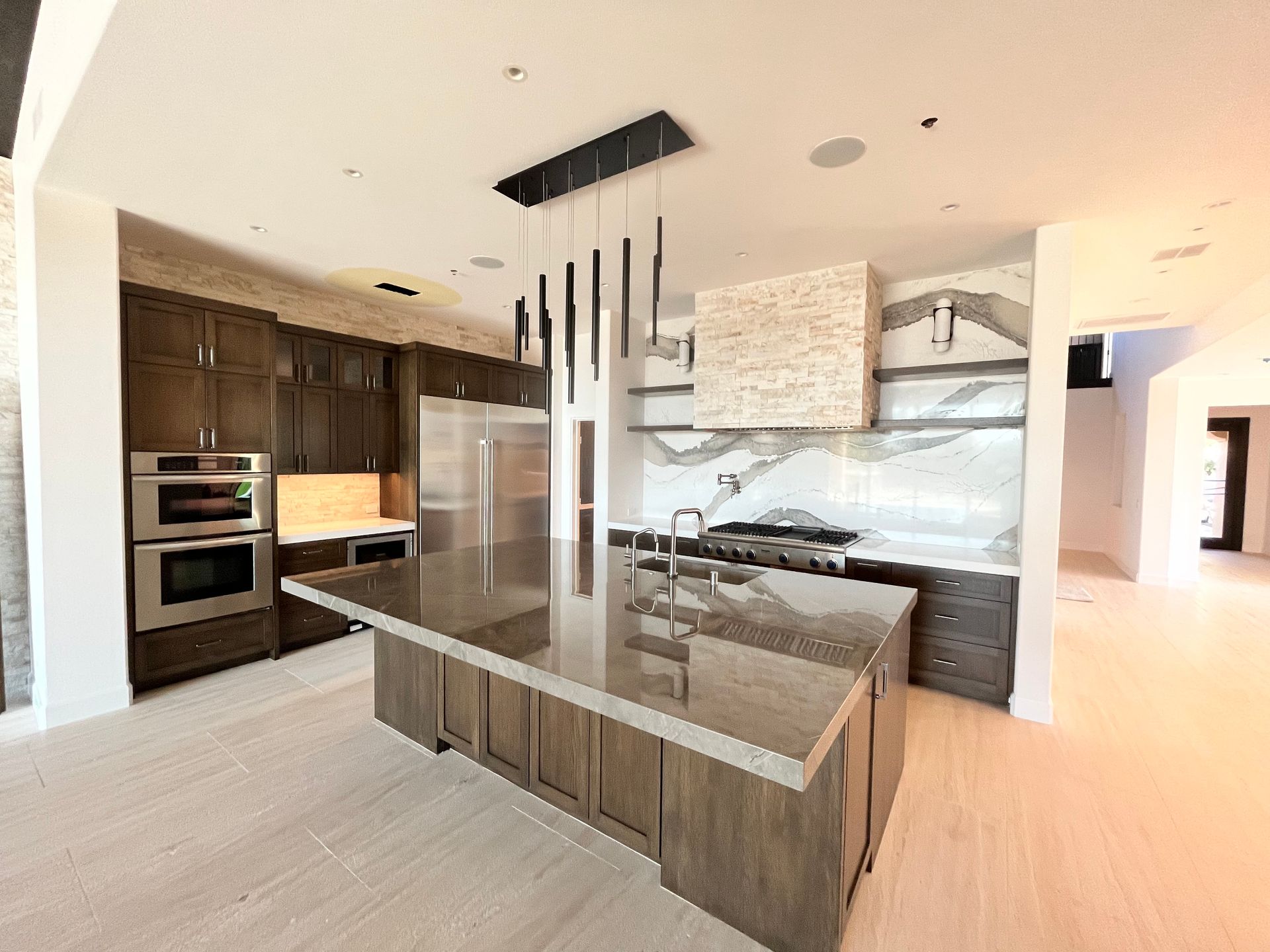 There is a large island in the middle of the kitchen.