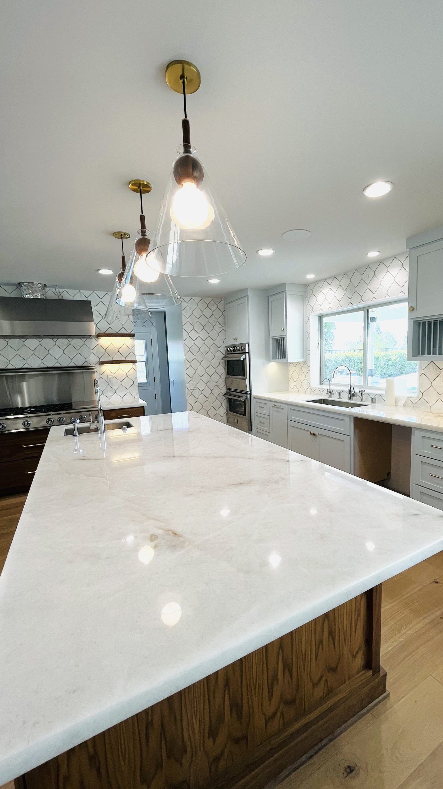 There is a large island in the middle of the kitchen.