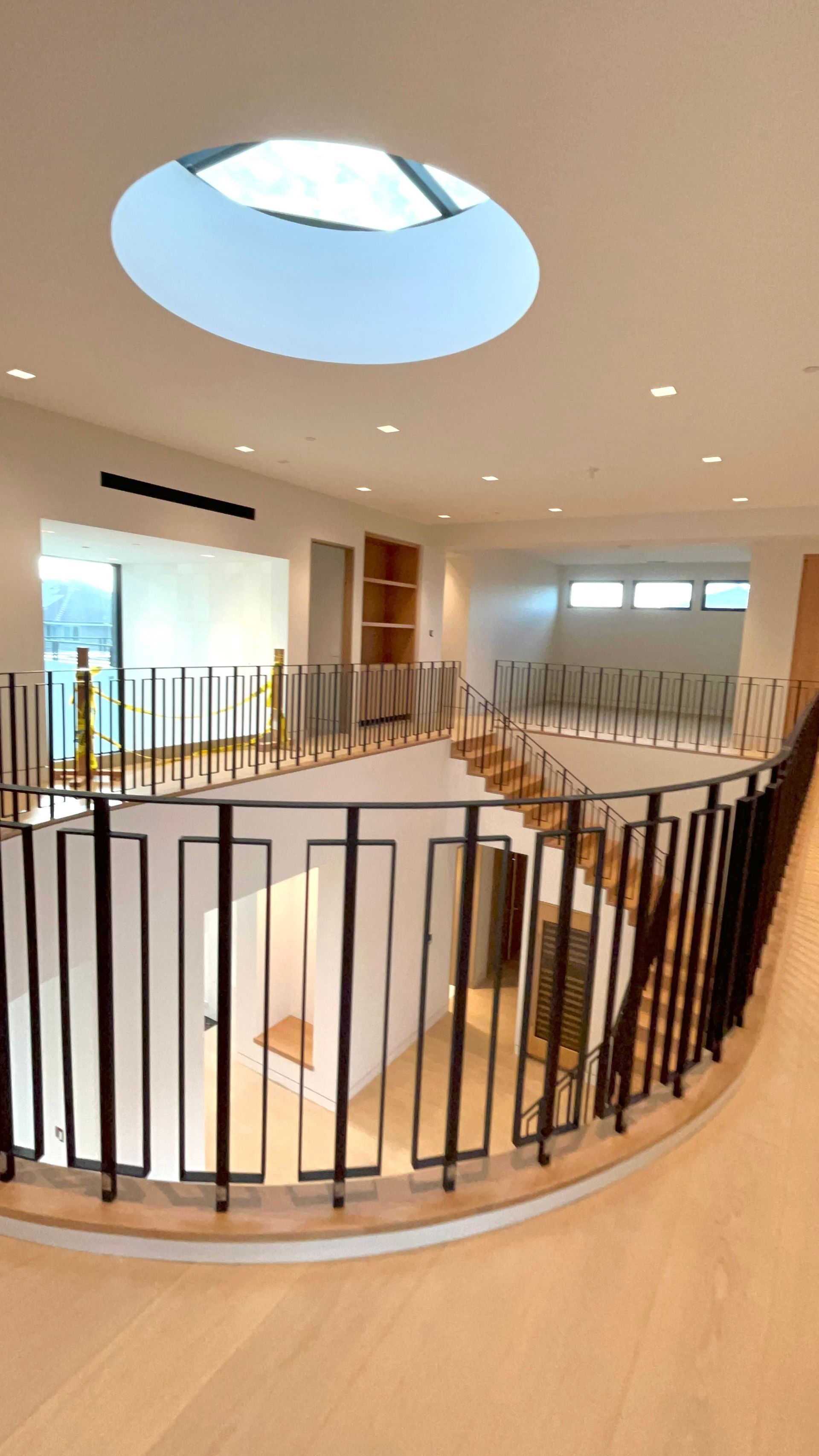 There is a round skylight in the middle of the room.