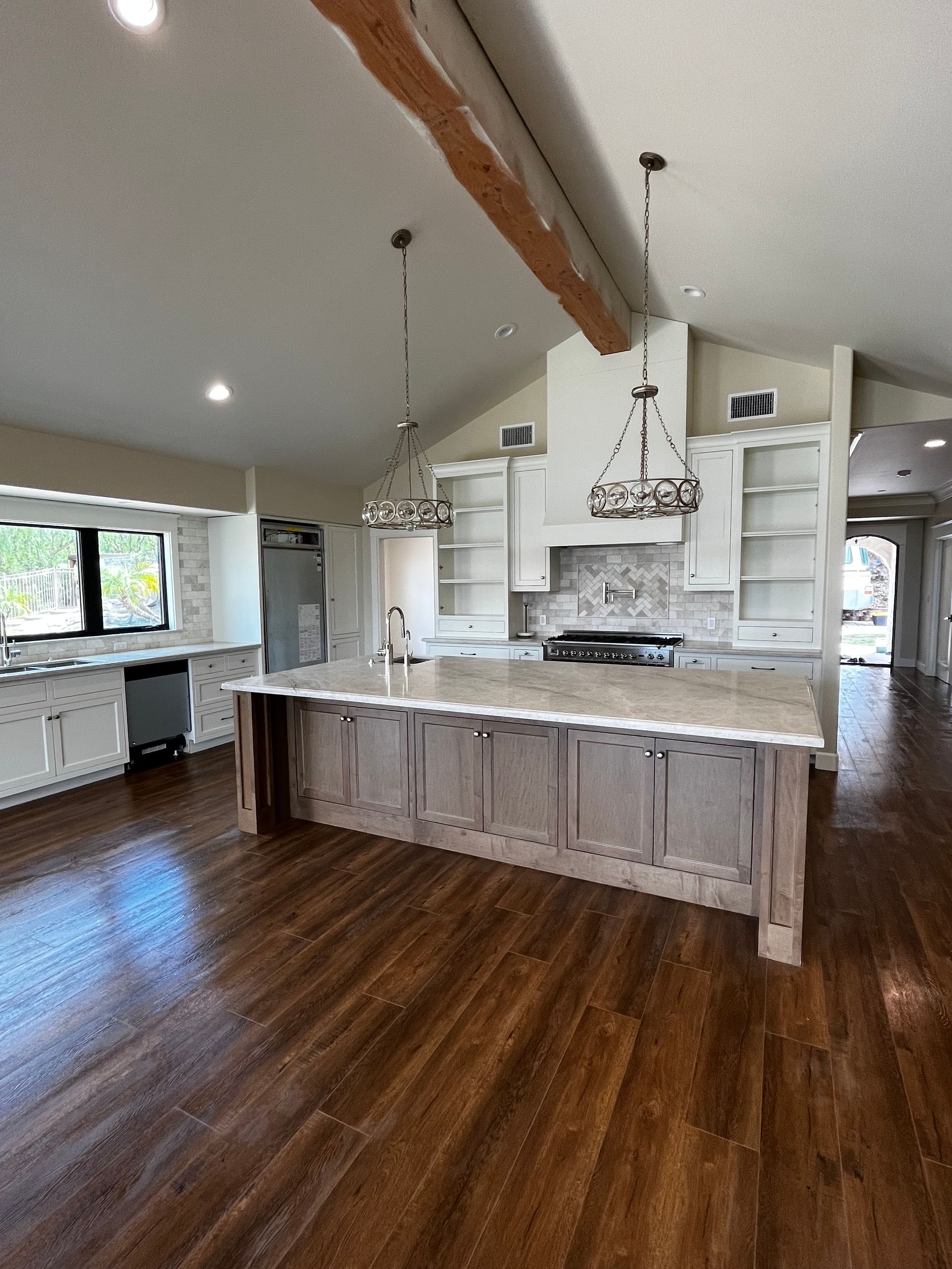 There is a large island in the middle of the kitchen.