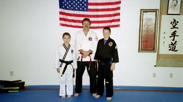 Kids With Their Black Belt Instructor — Richmond, KY — Richmond School of Karate