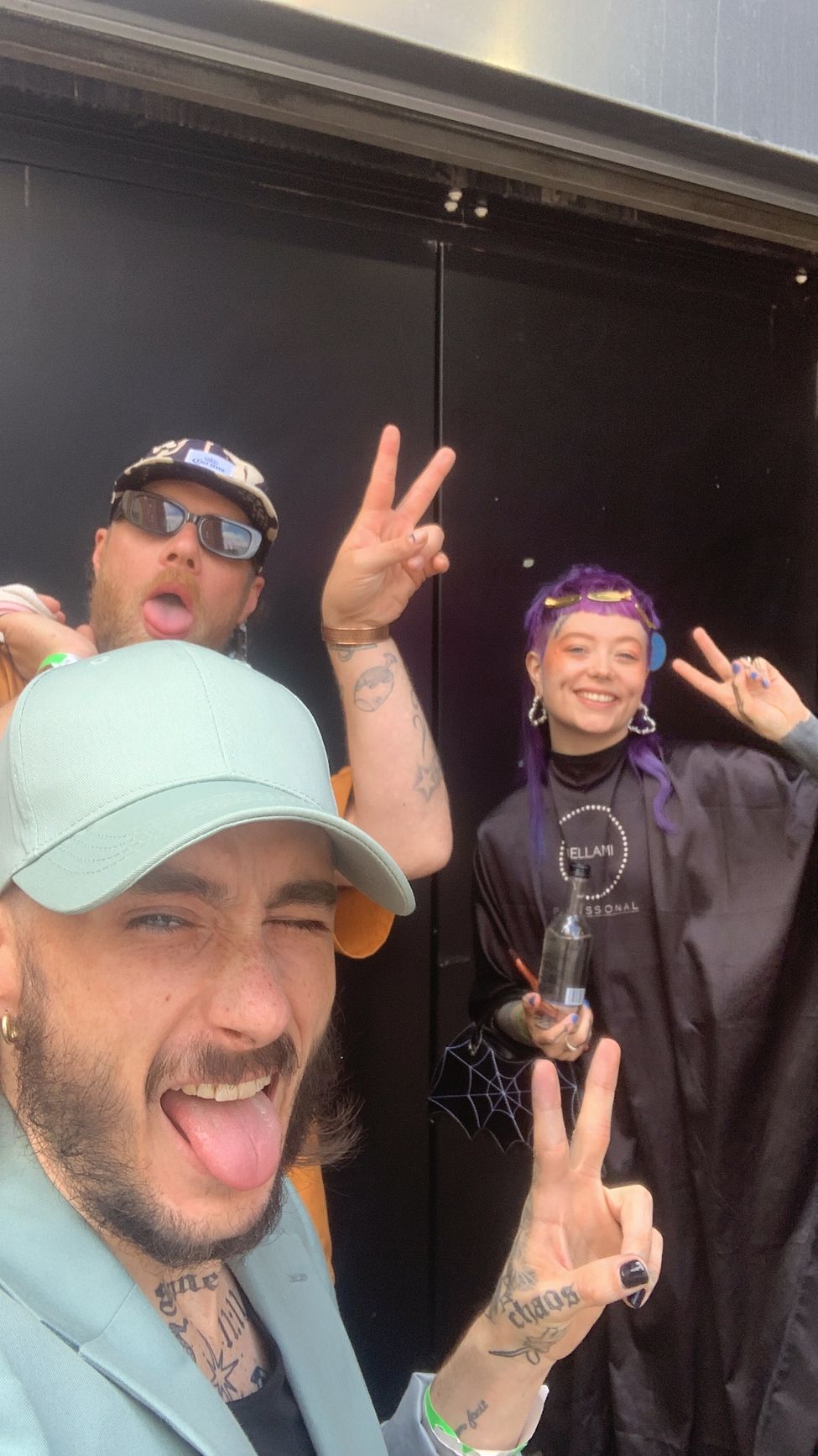 A client posing after having a creative colour and hair extenstion install on stage at Hair Con.