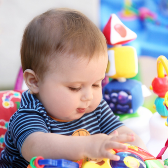 Infant Playing — Raleigh, NC — Pamela's Daycare Center