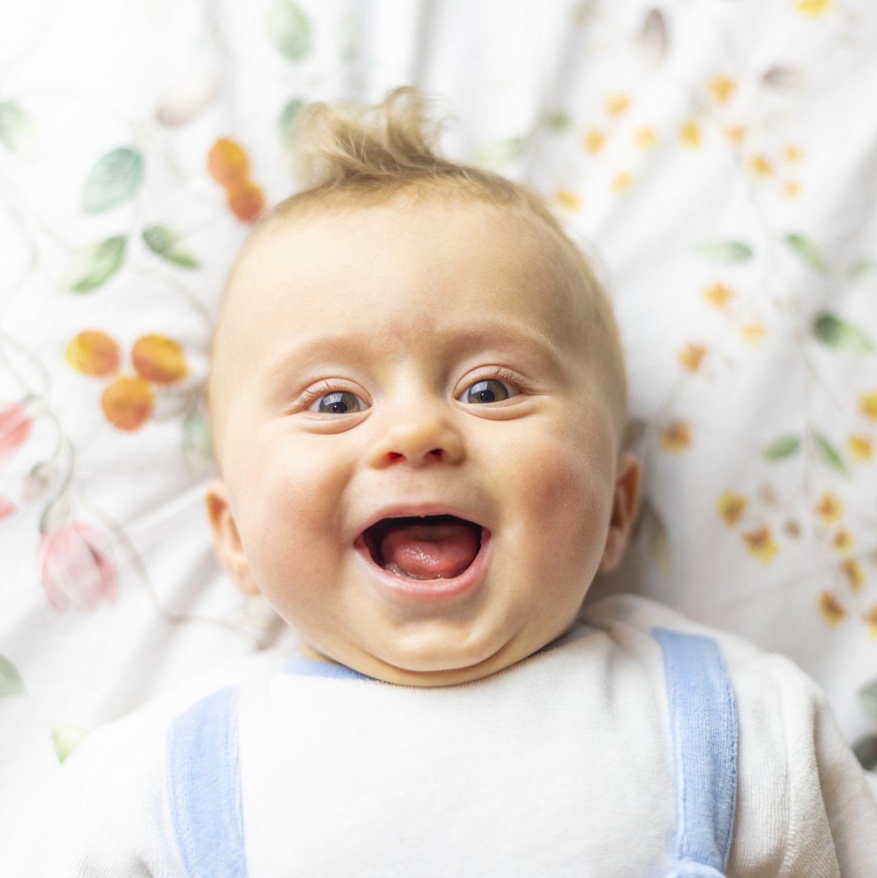 Baby Laughing In The Bed — Raleigh, NC — Pamela's Daycare Center