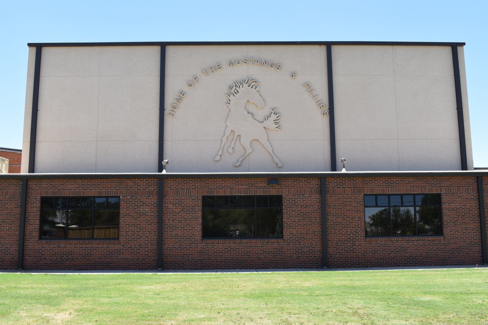 A large brick building with a ram on the side of it