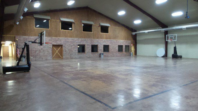 An empty basketball court in a large building