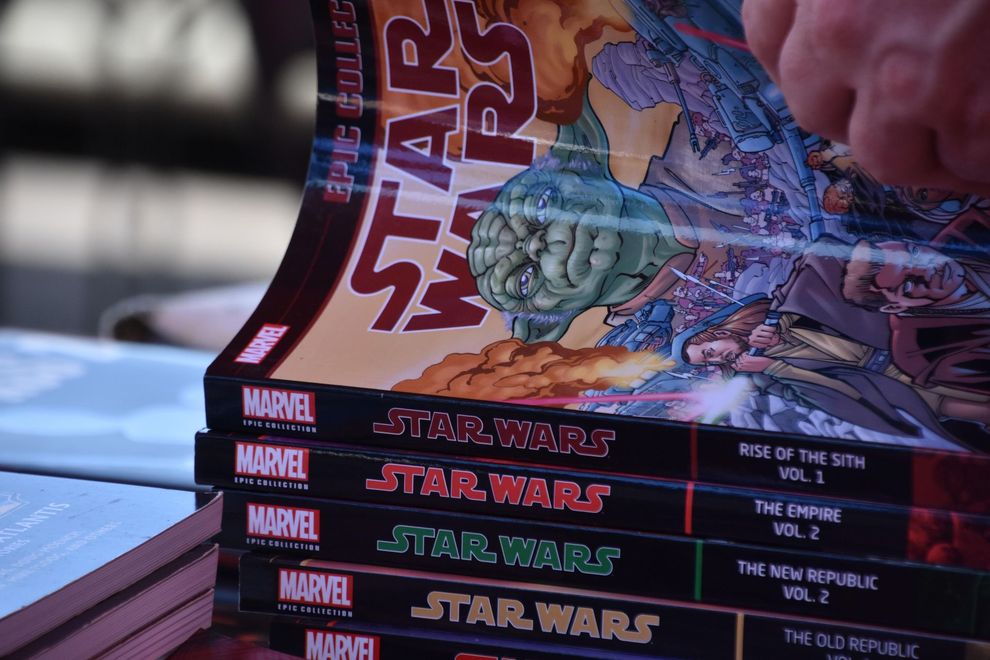 A stack of Marvel Star Wars Epic Collection graphic novels held by a hand.