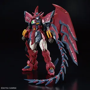 A red and dark blue Epyon Gundam action figure with wing-like back binders and a long, whip-like tail against a black background.