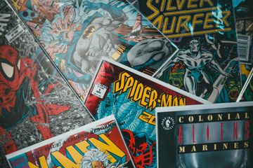A collage of various vintage comic book covers, including Spider-Man, Batman, Silver Surfer, X-Men, and Aliens.