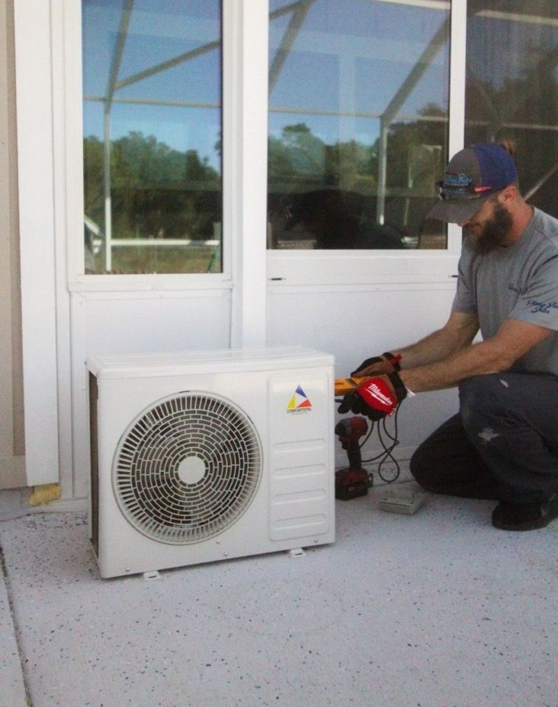 Two men are working on an electrical box - Milton, FL - Damn Fine Jobs