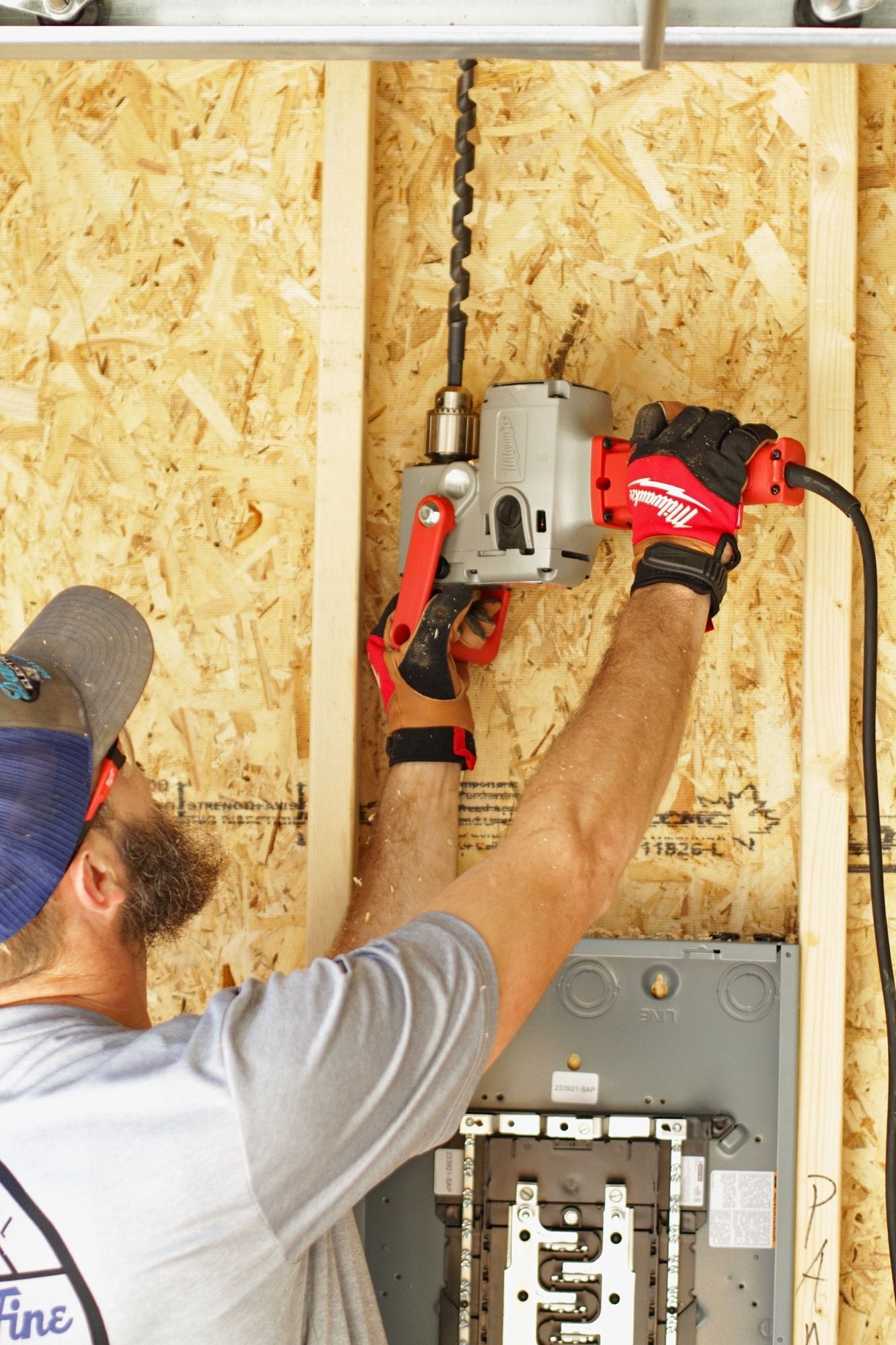 A man is using a drill to drill a hole in a wall - Milton, FL - Damn Fine Jobs