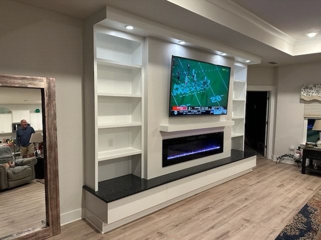 A living room with a flat-screen tv - Milton, FL - Damn Fine Jobs