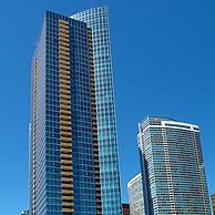 A tall building with a blue sky in the background