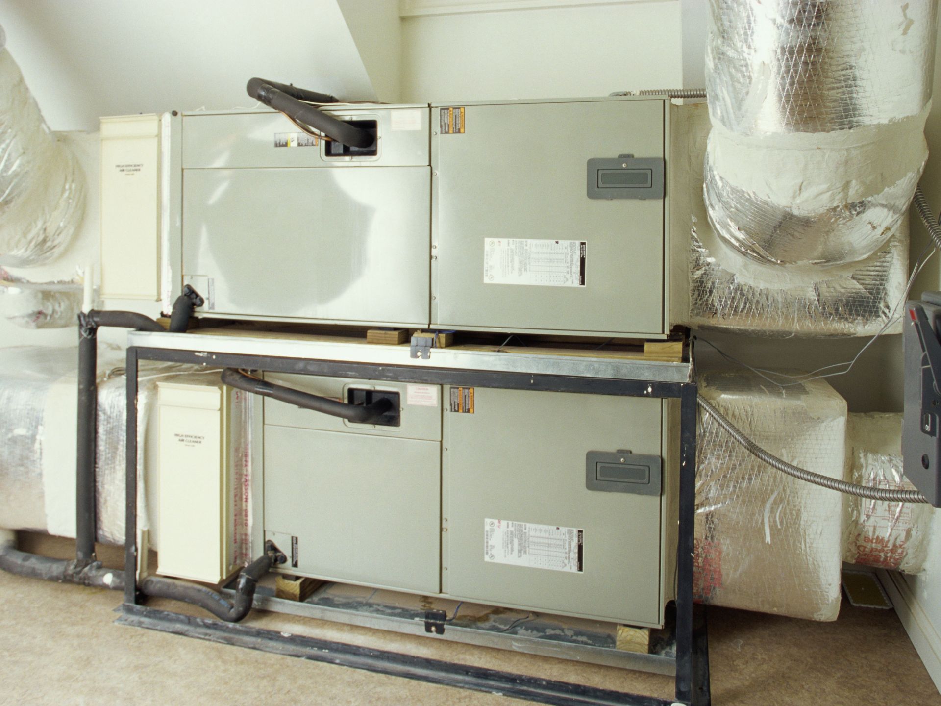 A room with a lot of electrical boxes and ducts