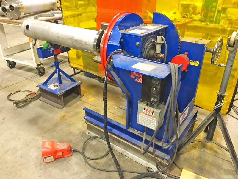 A machine is sitting on a cart in a factory.