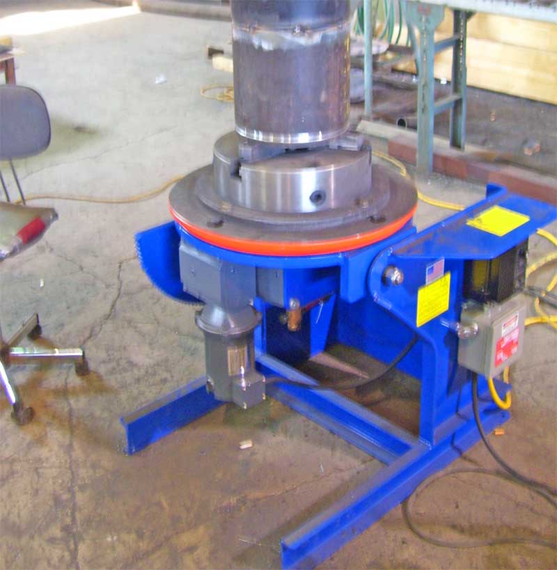 A blue machine with a yellow sticker on it