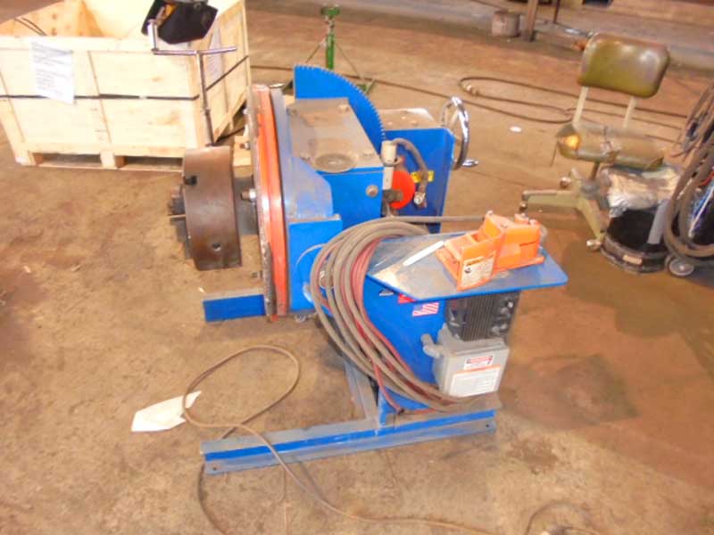 A blue machine with a hose attached to it