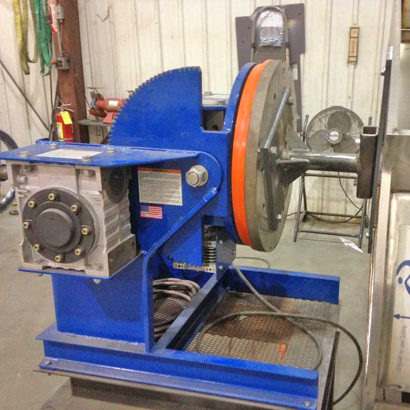 A blue and orange machine is sitting in a room