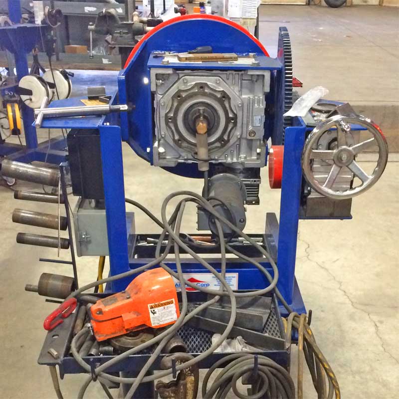 A blue machine with a warning label on it