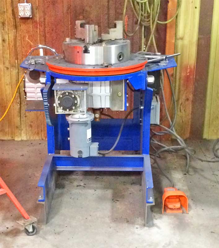 A machine is sitting in a room with a wooden wall behind it