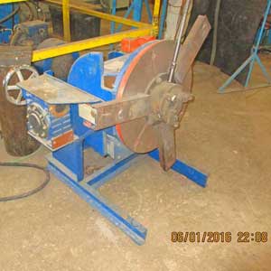 A machine is sitting on the floor in a factory.