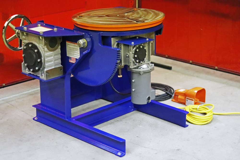 A machine is working on a piece of metal in a factory.