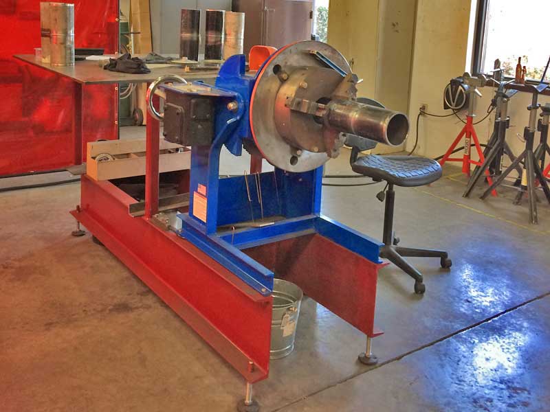 A machine is sitting in a room next to a chair