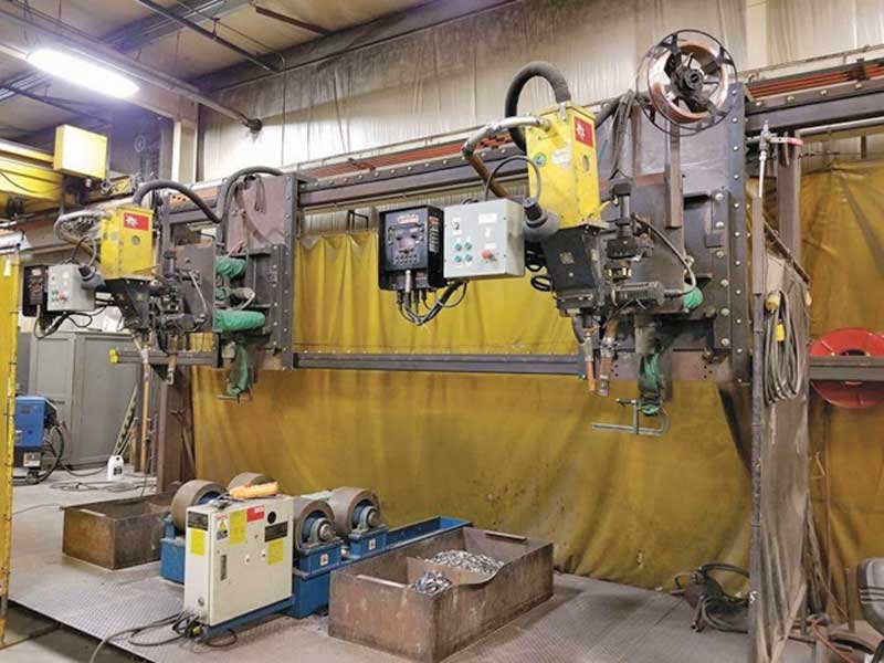 A machine is sitting in a room with a yellow curtain.
