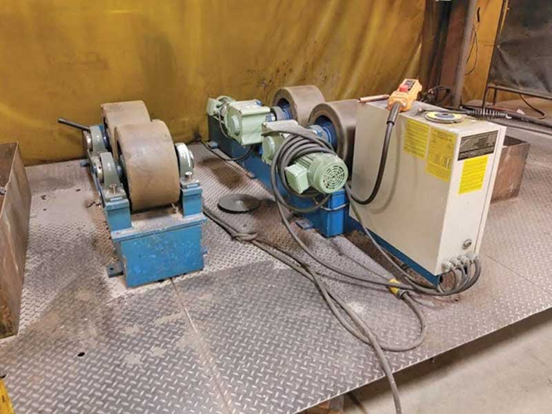 A machine is sitting on top of a metal surface in a room.